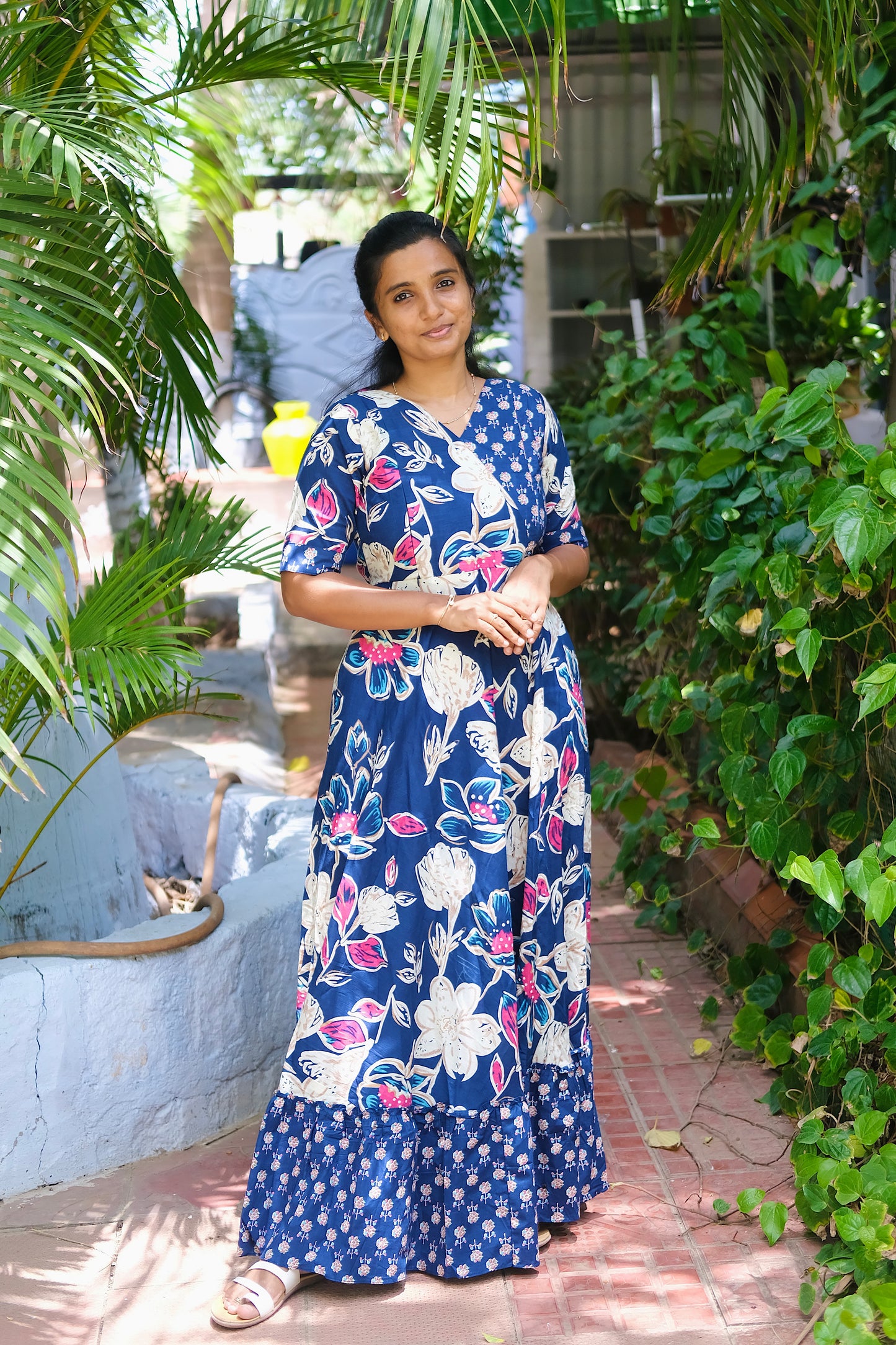 A-line cotton maxi dress in blue with elbow-length sleeves and floral patterns