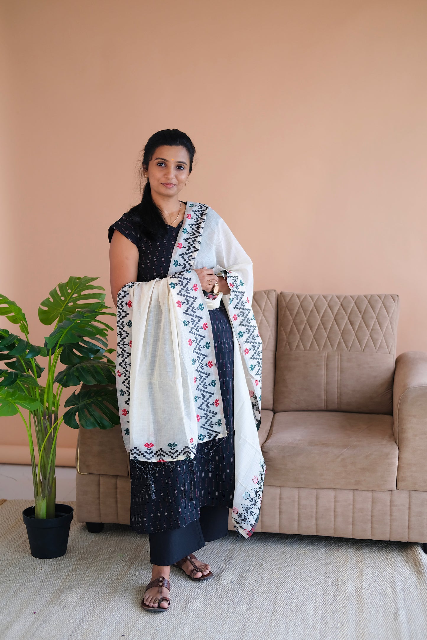Model showcasing the Vibha black ikat kurti set with dupatta draped elegantly