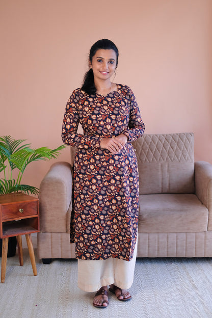 Front view of Tanisha black printed cotton straight kurti with full sleeves and traditional block print motifs.
