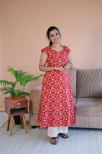 Red printed cotton a line kurti paired with cream pants