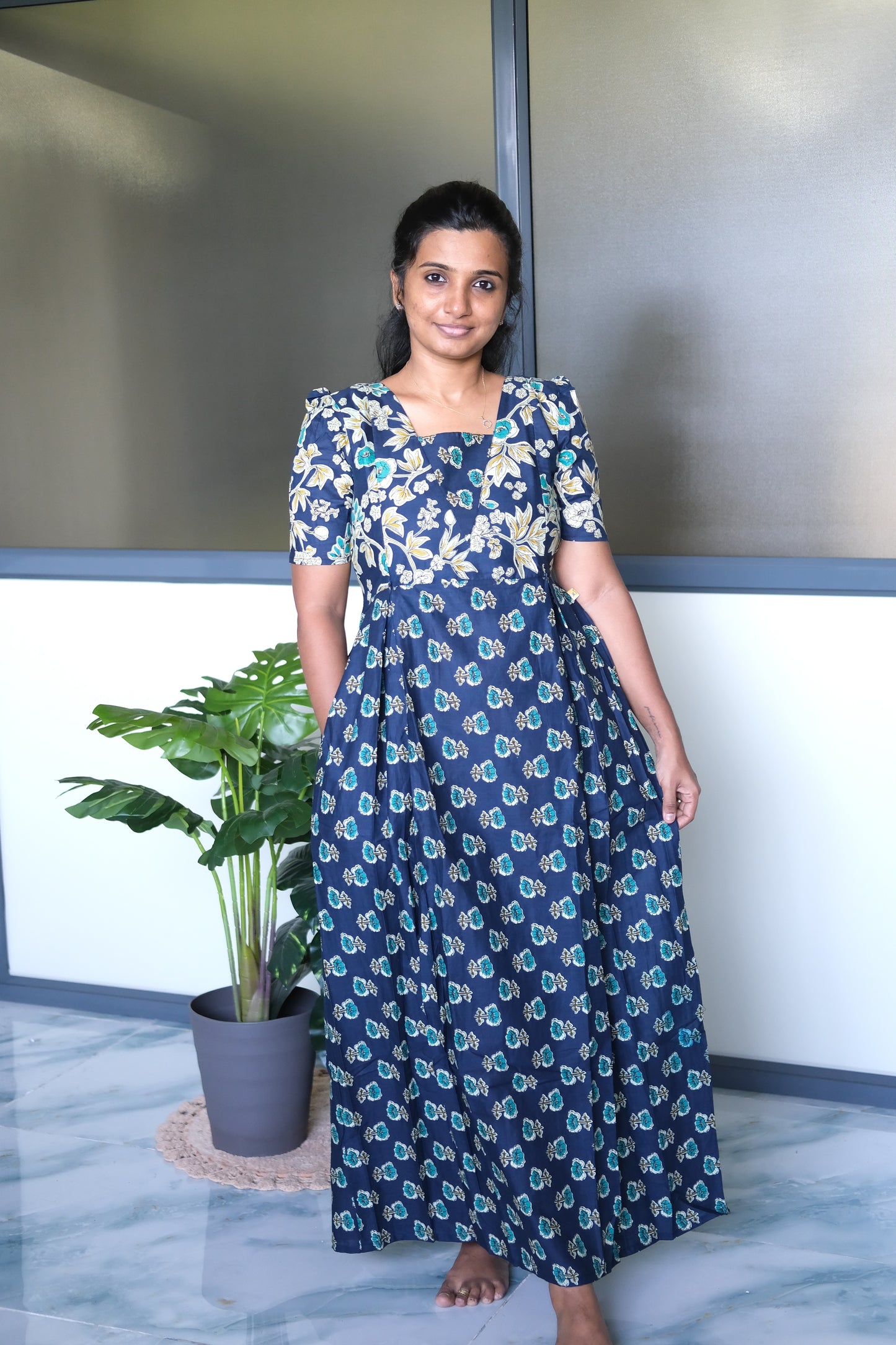 Dark blue cotton nighty with zip details and convenient side seam pockets, styled in a relaxed maxi length.