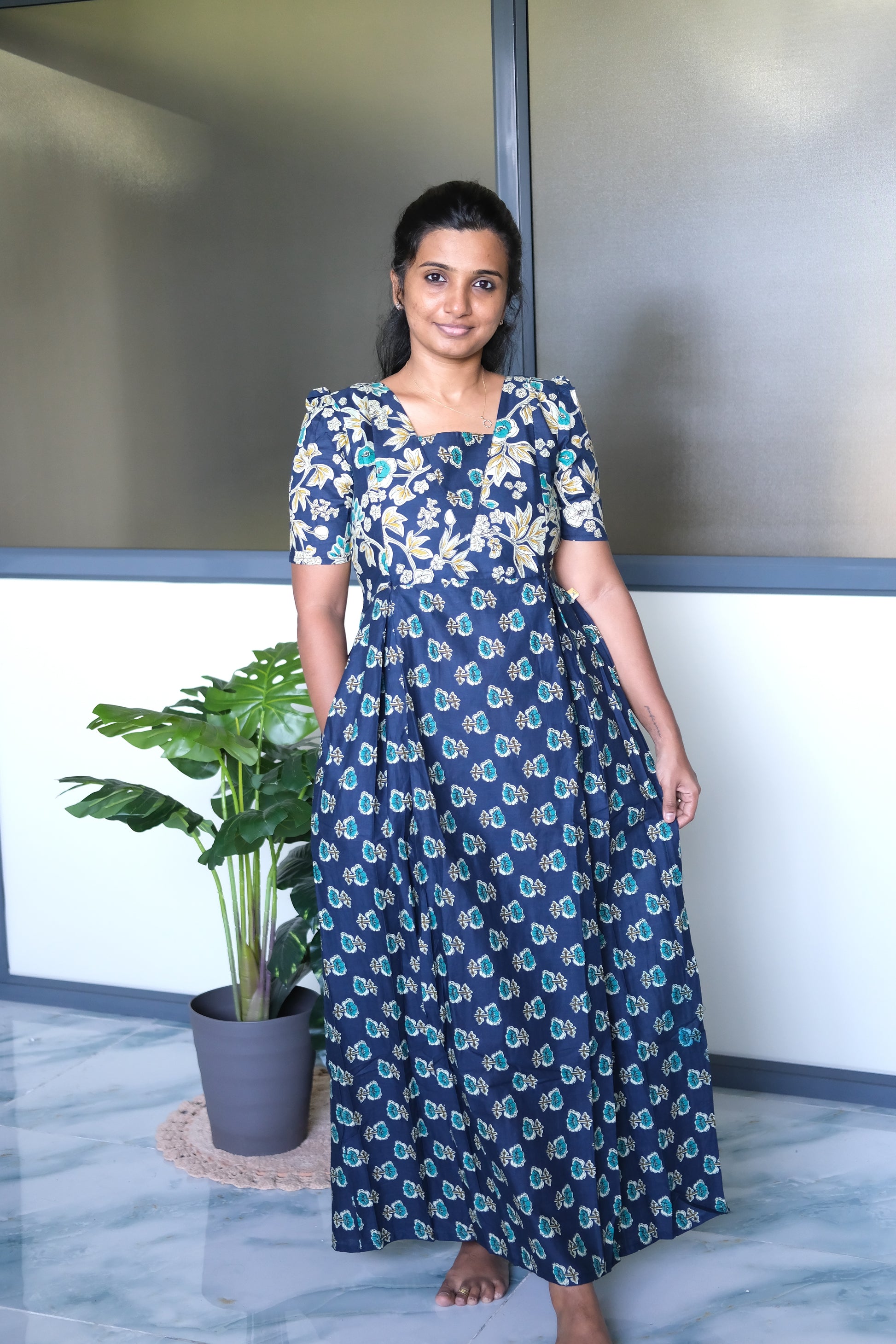 Dark blue cotton nighty with zip details and convenient side seam pockets, styled in a relaxed maxi length.