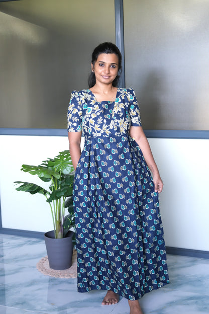 Dark blue cotton nighty with zip details and convenient side seam pockets, styled in a relaxed maxi length.