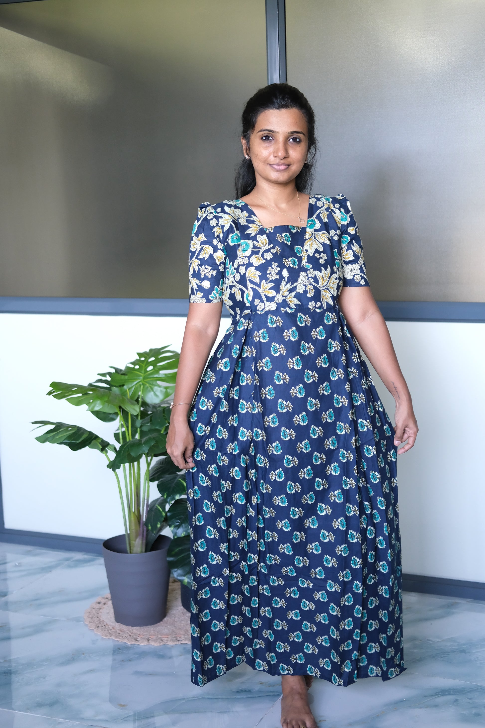 Full-length front view of the dark blue cotton maxi nighty draped elegantly, highlighting the comfortable flared silhouette.