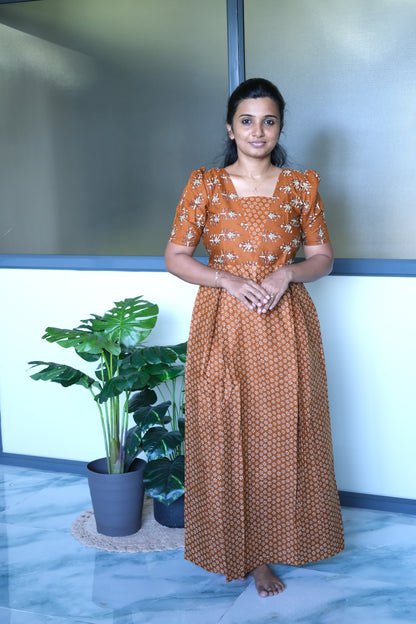 Mustard cotton feeding nighty with a square neckline, short puff sleeves, and embroidered yoke detailing.