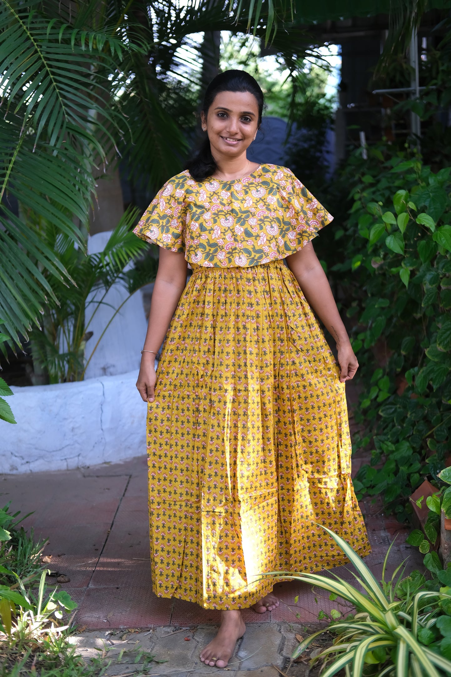 Ankle-length floral print nighty in breathable mustard yellow cotton with a relaxed fit silhouette.