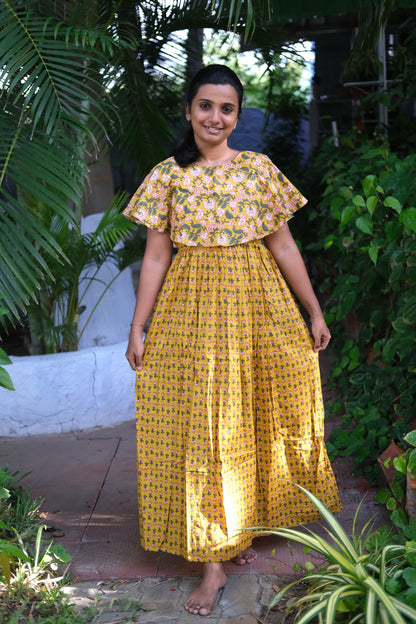Ankle-length floral print nighty in breathable mustard yellow cotton with a relaxed fit silhouette.