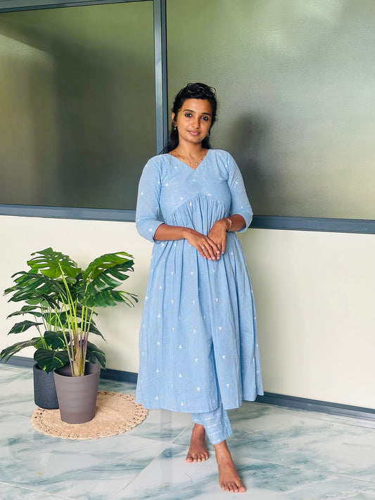 Sky blue handloom cotton kurti set featuring an Alia cut silhouette with gathered waist and matching printed pants.