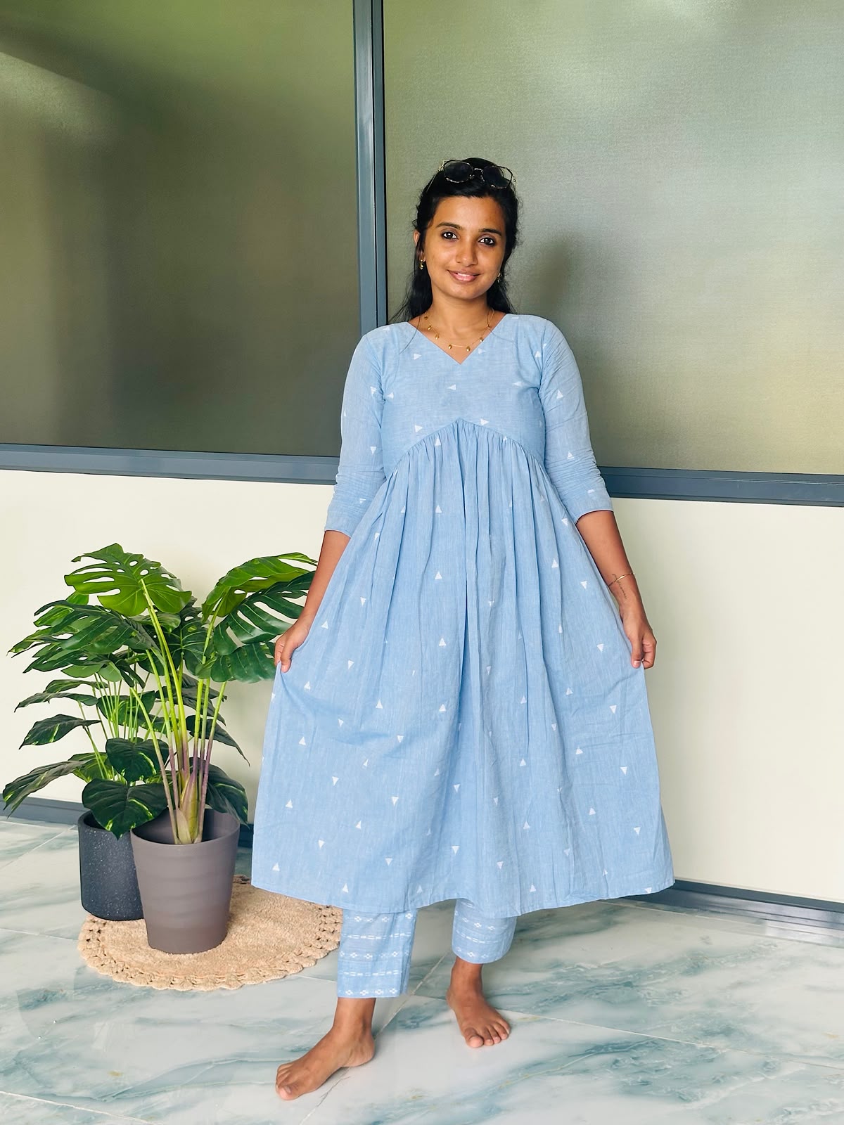 A-line flared sky blue handloom cotton kurti set with 3/4th sleeves and V-neckline.