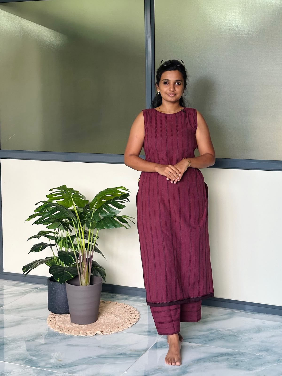 Burgundy handloom cotton co-ord set featuring a sleeveless kurti with vertical stripes and matching palazzo pants.
