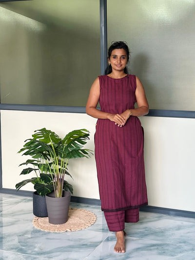 Burgundy handloom cotton co-ord set featuring a sleeveless kurti with vertical stripes and matching palazzo pants.