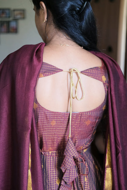 Back view showing deep keyhole neck design with gold dori tie-up and tassel details
