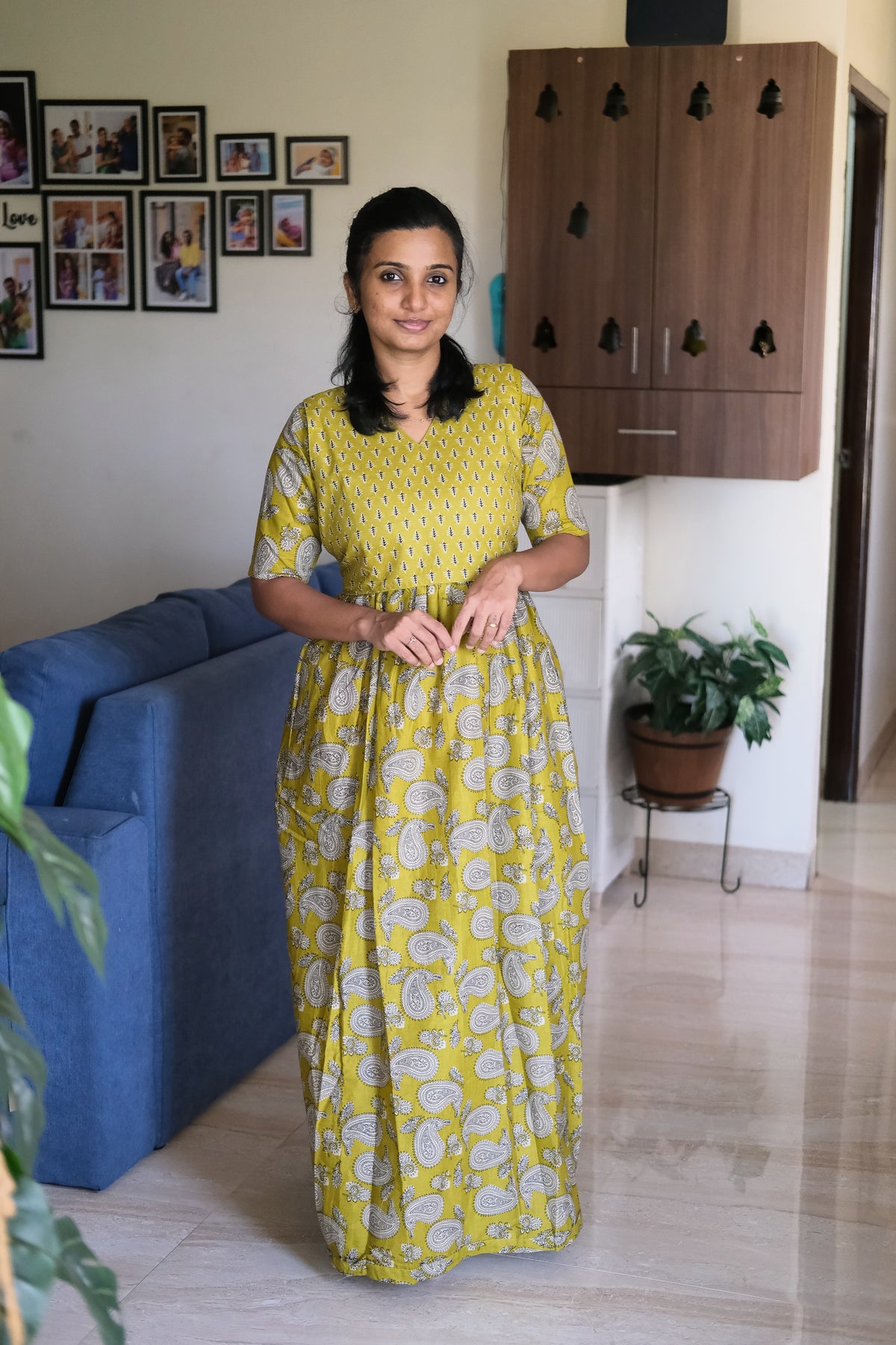 Full length view of the mustard yellow maternity maxi dress with relaxed fit