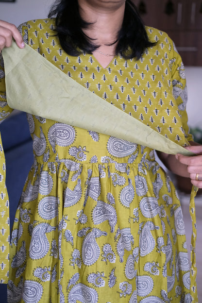 Close-up of the tie up cover on the mustard yellow cotton feeding nighty showing hidden nursing zips