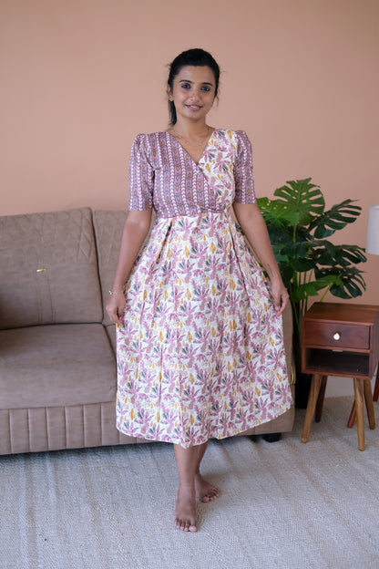 Off-white and mauve printed cotton midi nighty with a wrap-style bodice and short sleeves.