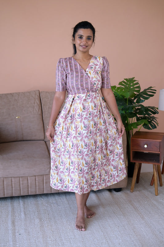 Off-white and mauve printed cotton midi nighty with a wrap-style bodice and short sleeves.