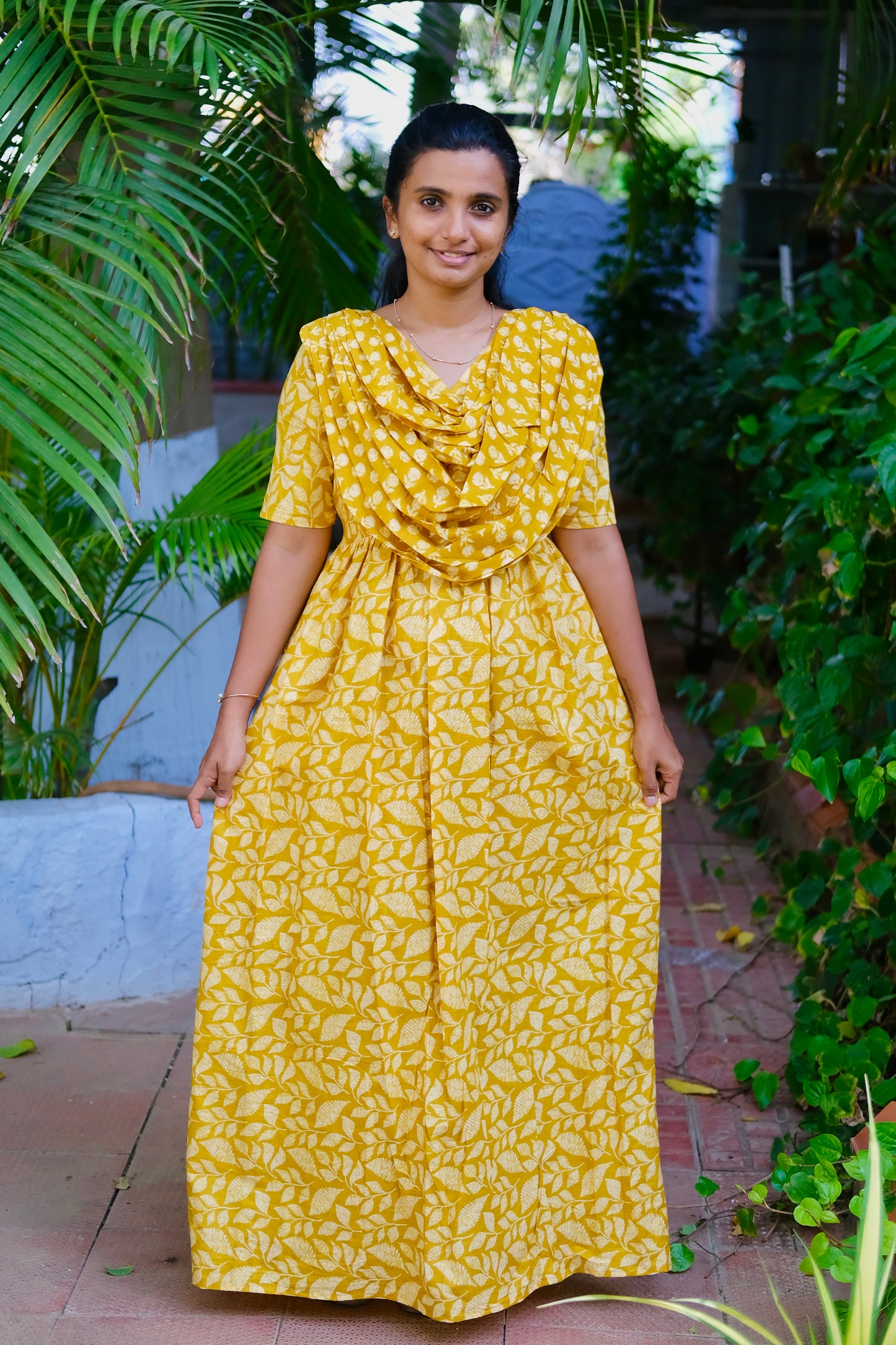 Yellow cotton maxi nighty with an attached dupatta drape and white leaf prints