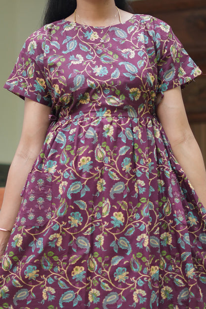 Close-up of the kalamkari print on the maroon feeding nighty cotton fabric with side tie-up detail