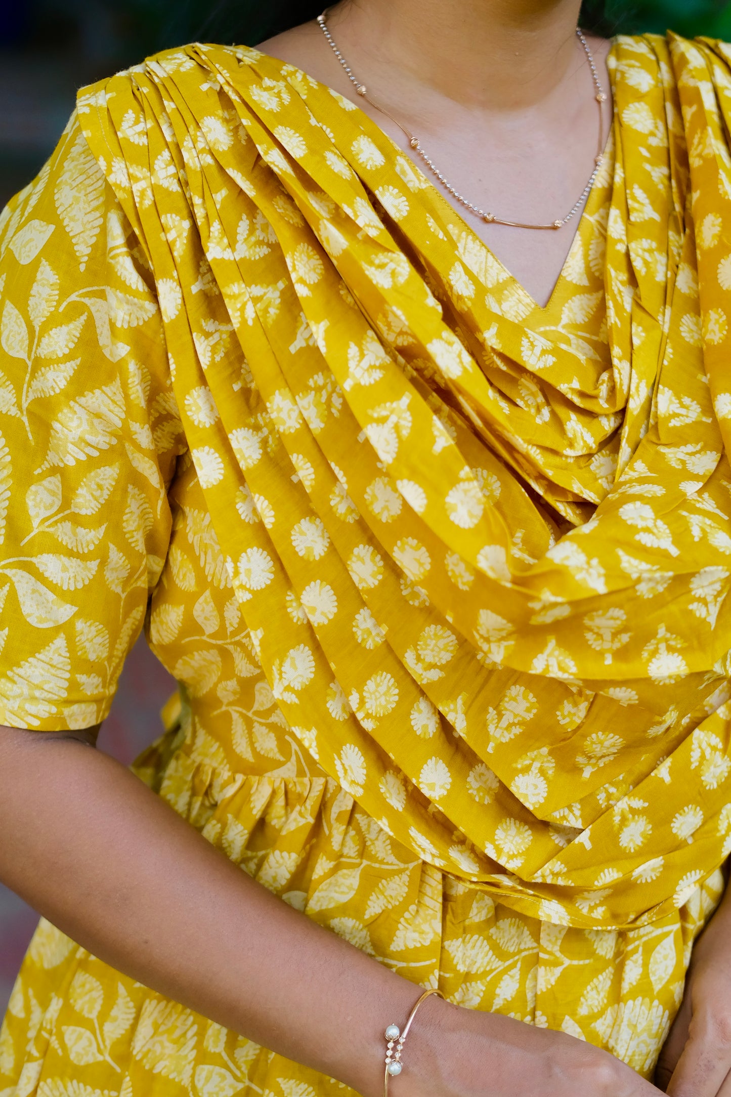Close-up of the pleated chest drape on the yellow feeding friendly nighty
