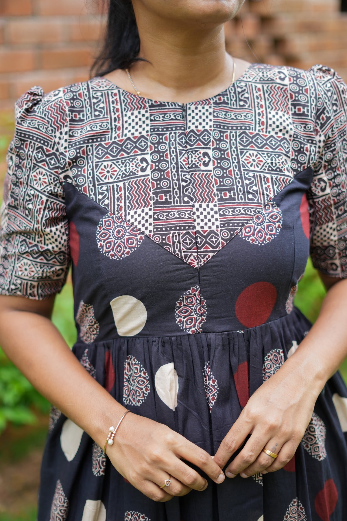 Close-up of the geometric printed yoke and puff sleeves on the cotton maxi nighty.