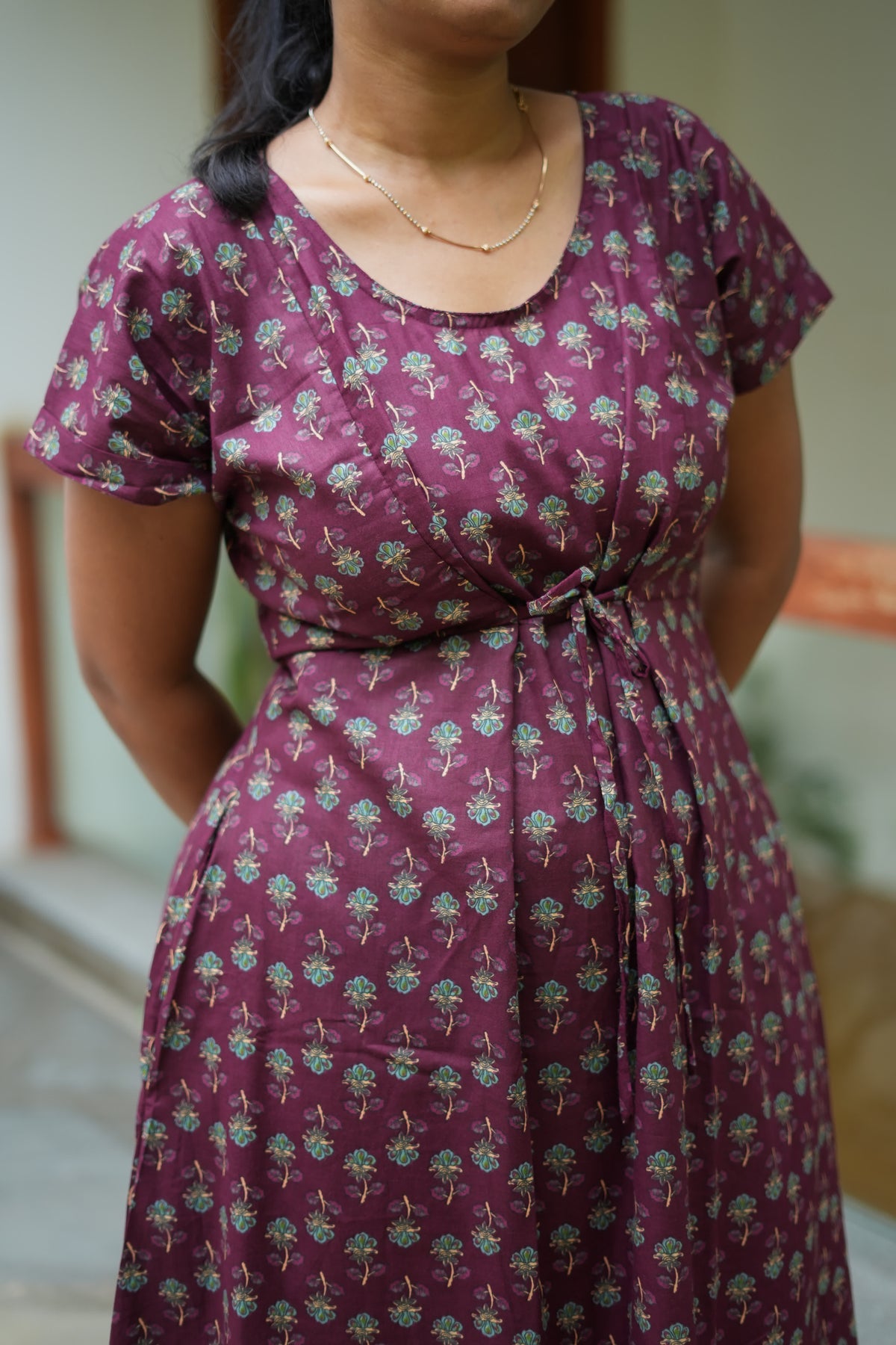Close-up of the front tie and hidden zipper panels on the Tanvi dark wine cotton nighty for women.