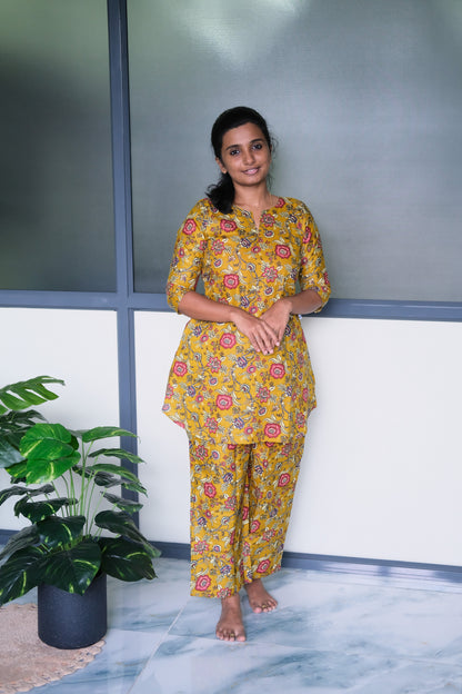 Mustard yellow cotton night suit for women with pink floral prints