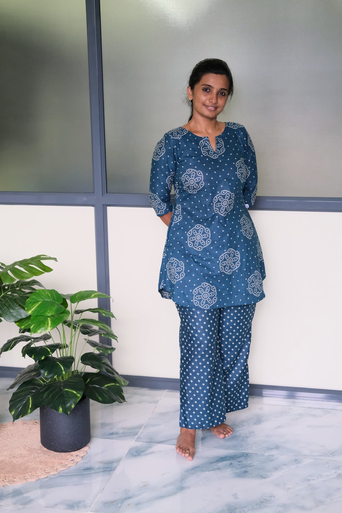Full-length view of the blue cotton night suit with geometric patterned pants and a notched neckline tunic top.