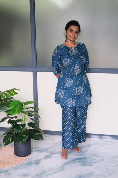 Full-length view of the blue cotton night suit with geometric patterned pants and a notched neckline tunic top.