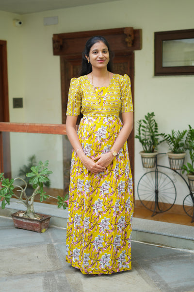 Mustard yellow cotton maxi nighty with dual floral prints and puff sleeves.