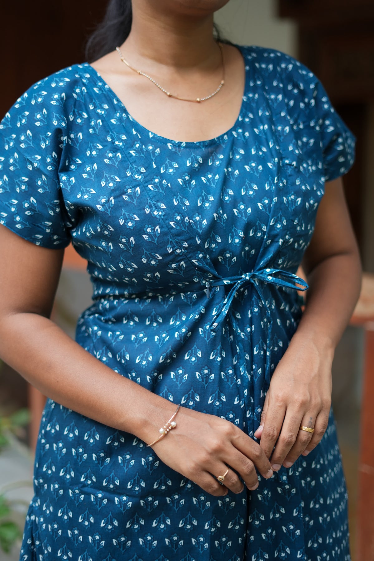 Close-up of the front tie and hidden zip details on the feeding nighty with zip
