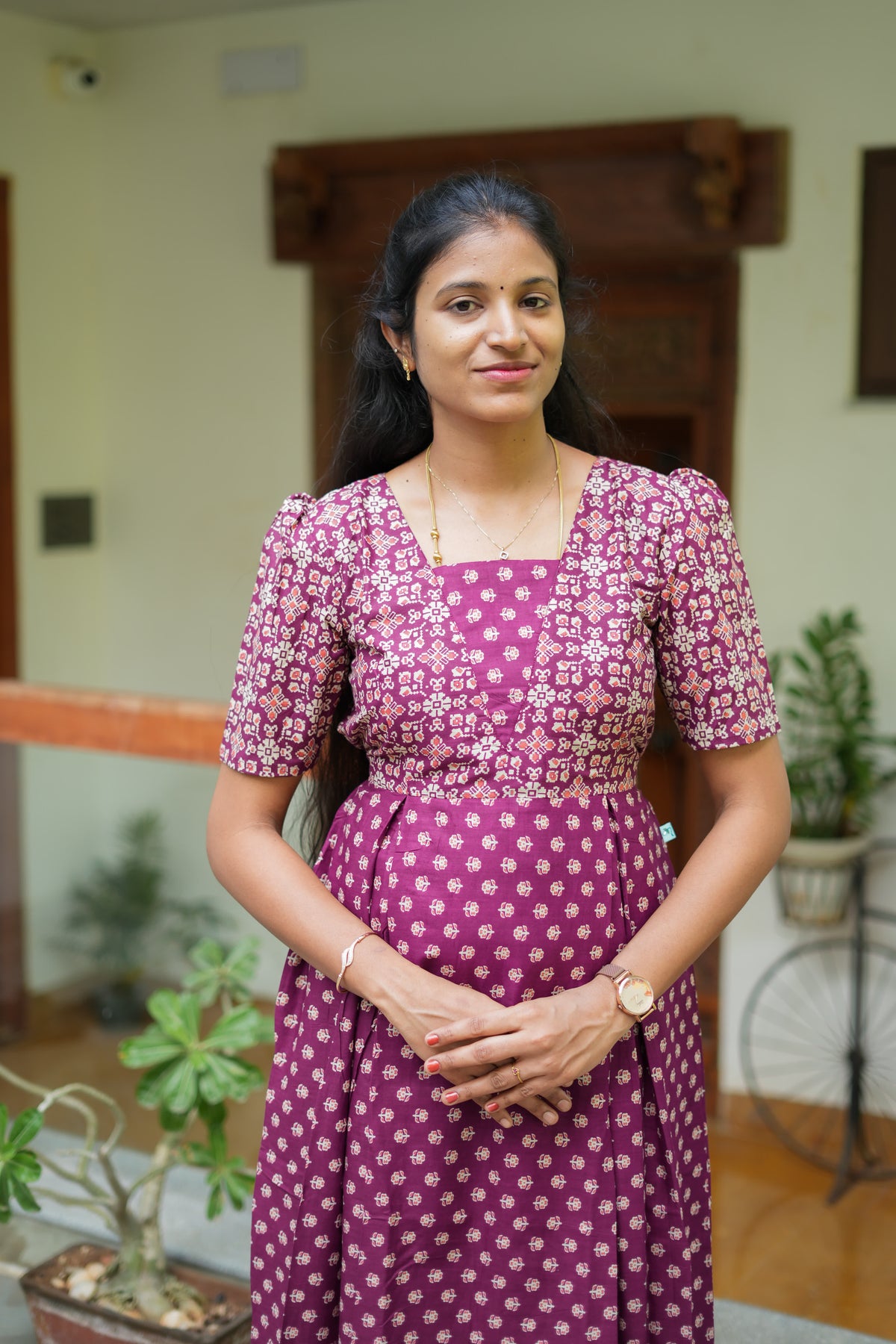 Close-up of the square neckline and dual-print yoke on the purple feeding nighty with zip.