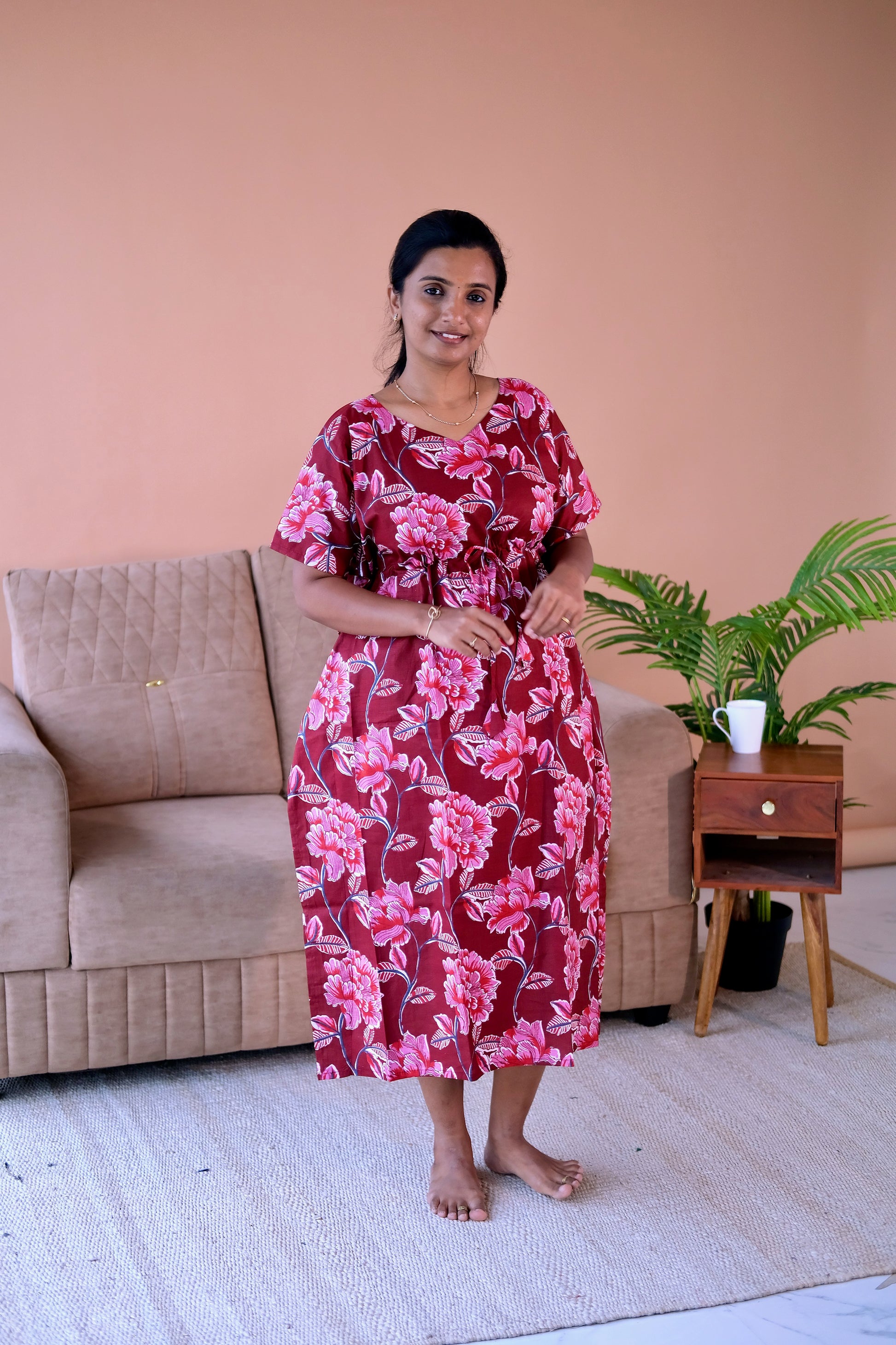 Front view of the floral midi nighty for women in maroon cotton, showcasing the relaxed kaftan sleeves and comfortable fit.