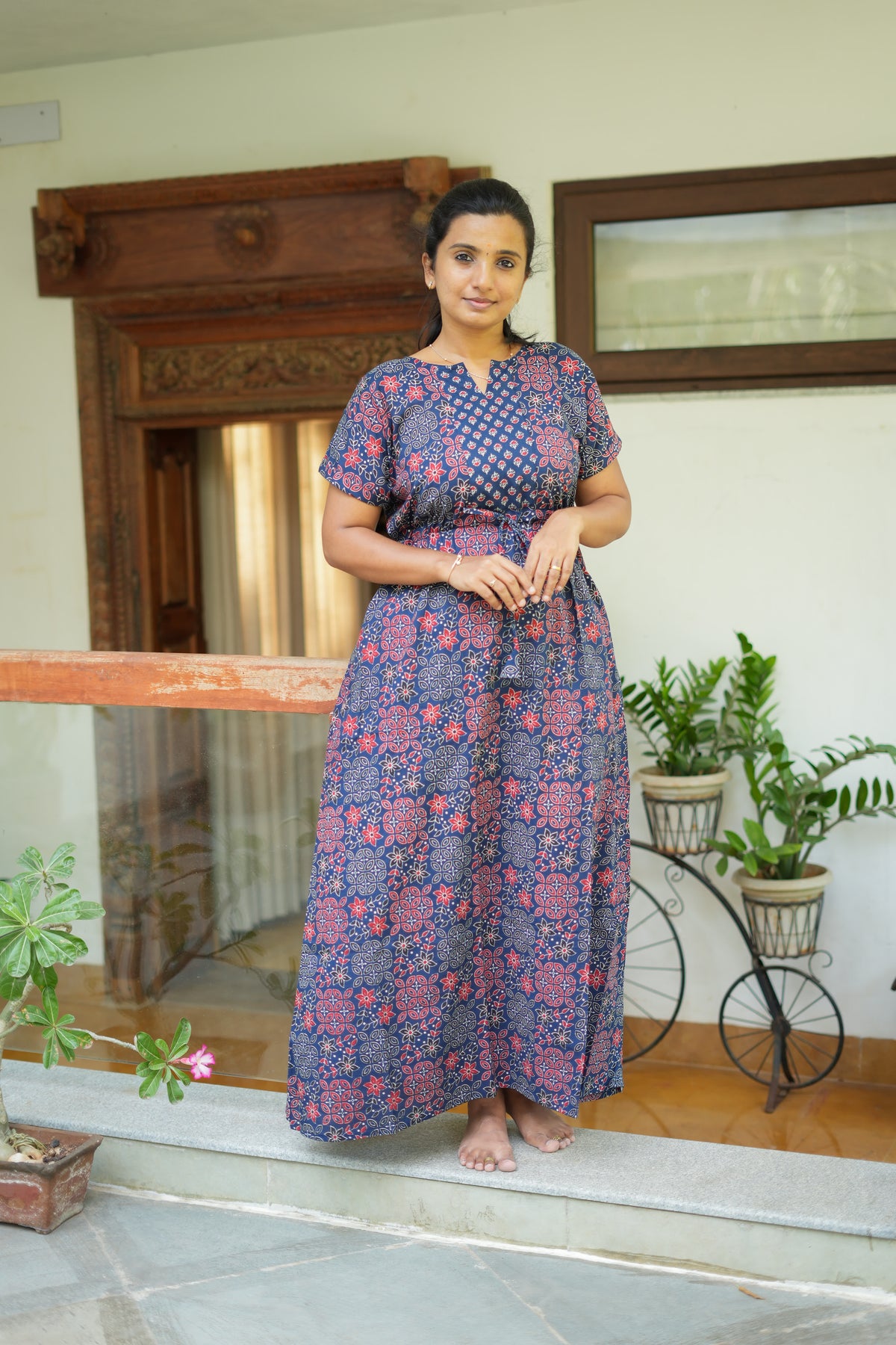 Navy blue cotton nighty with red floral print and waist tie-up