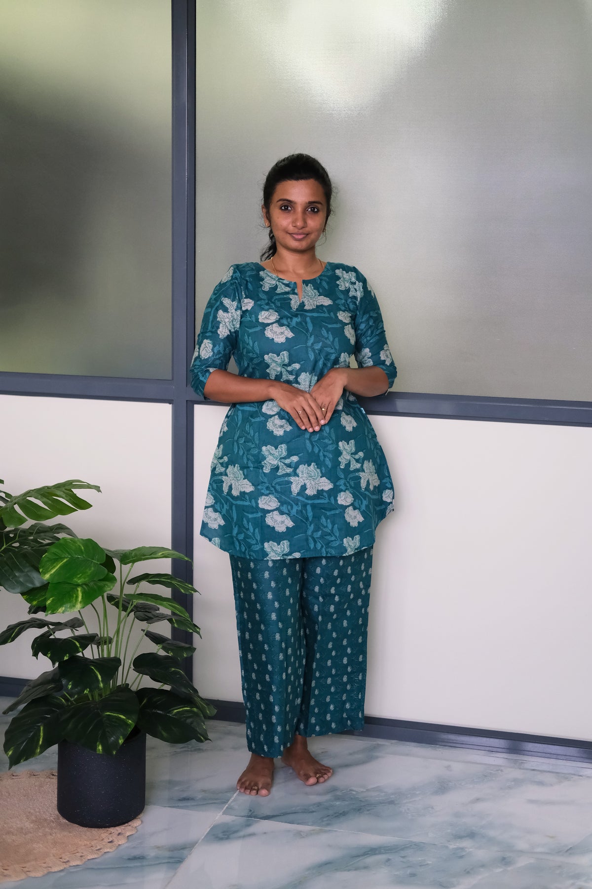 Heera peacock blue cotton night suit for women featuring a floral printed A-line top and matching relaxed pants