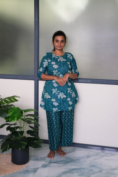 Heera peacock blue cotton night suit for women featuring a floral printed A-line top and matching relaxed pants
