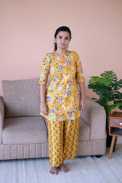 Comfortable cotton night suit set for women in a vibrant golden mustard floral print.