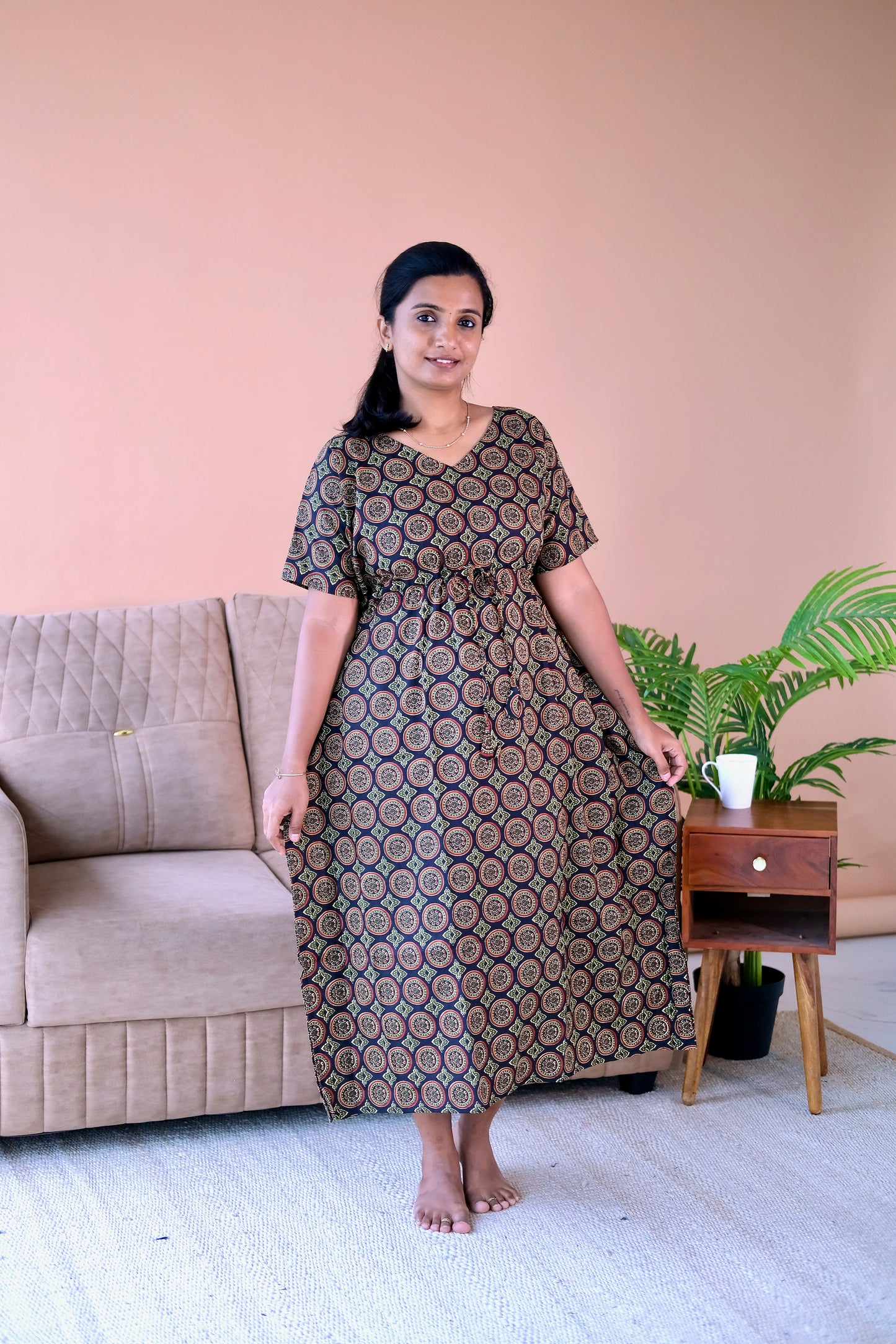 Midi-length cotton midi night dress in black and earthy tones showing the relaxed drape and V-neckline.