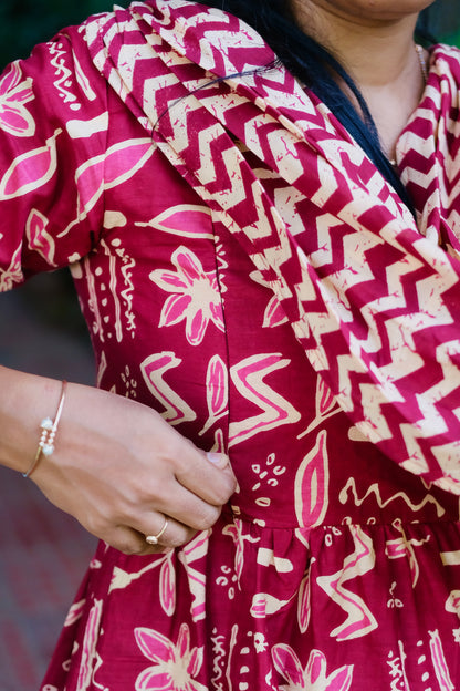 Close-up of the side zipper on the feeding friendly nighty showing the red batik print.