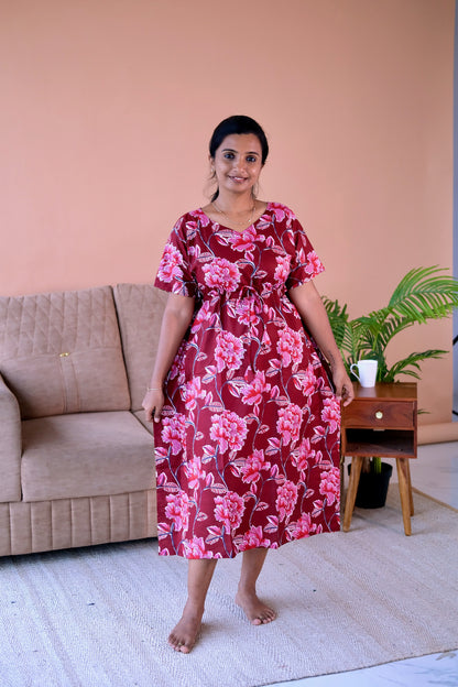 Maroon cotton kaftan nighty with pink floral prints, featuring a V-neckline and an adjustable drawstring waist.