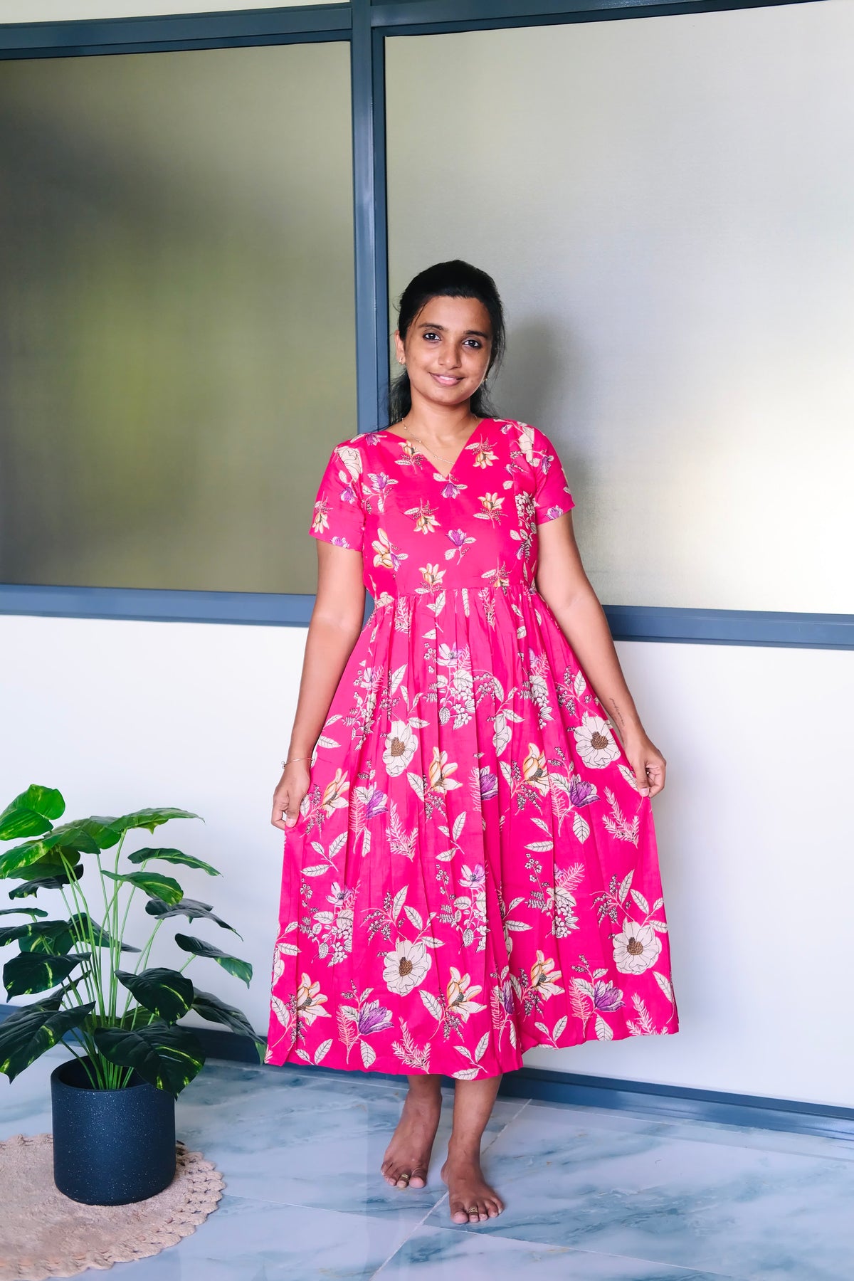 A-line cotton midi nighty in vibrant pink with all-over floral print and short sleeves.