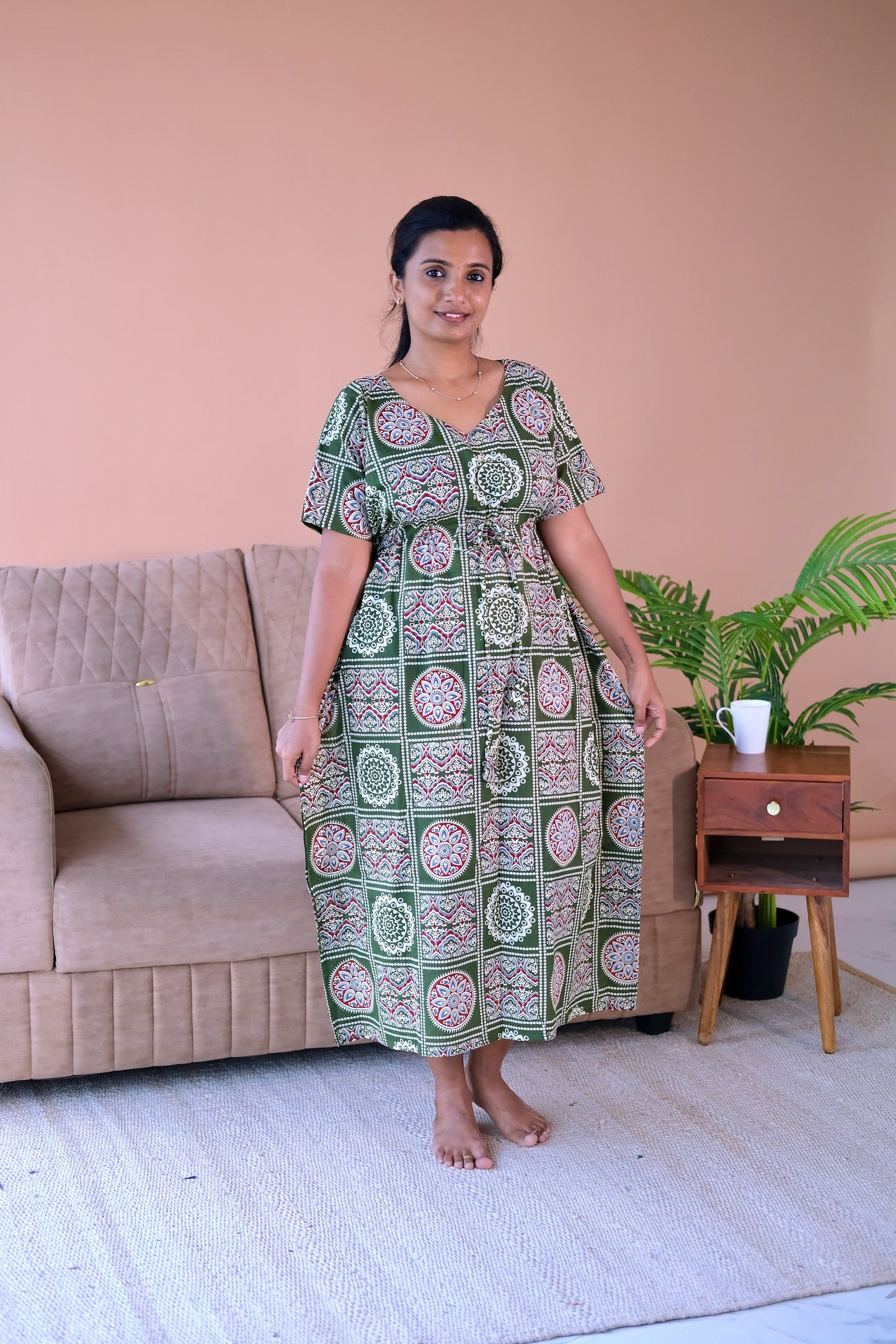 Comfortable cotton nighty with drawstring waist and V-neckline in a green geometric print.