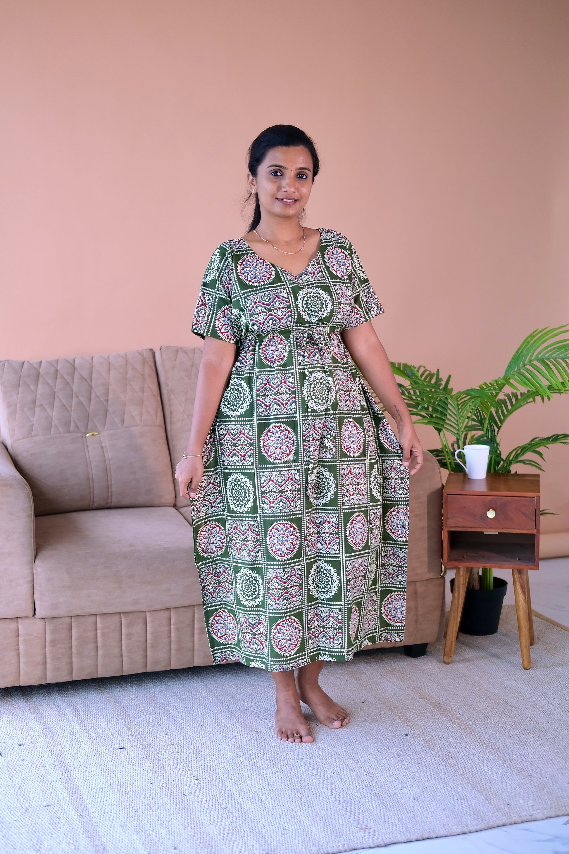 Comfortable cotton nighty with drawstring waist and V-neckline in a green geometric print.