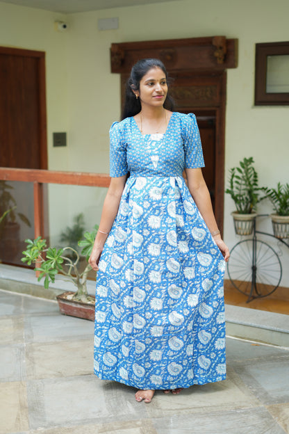 A relaxed-fit maternity cotton nighty featuring a flared skirt with a traditional Indian floral and paisley print.