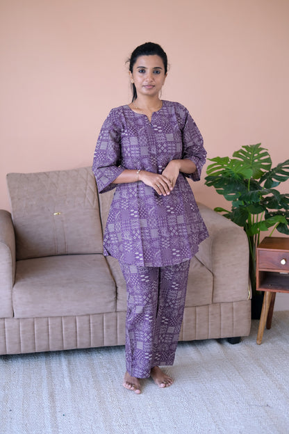 Dusty plum printed cotton night suit for women featuring a flared top with bell sleeves and matching relaxed pants.