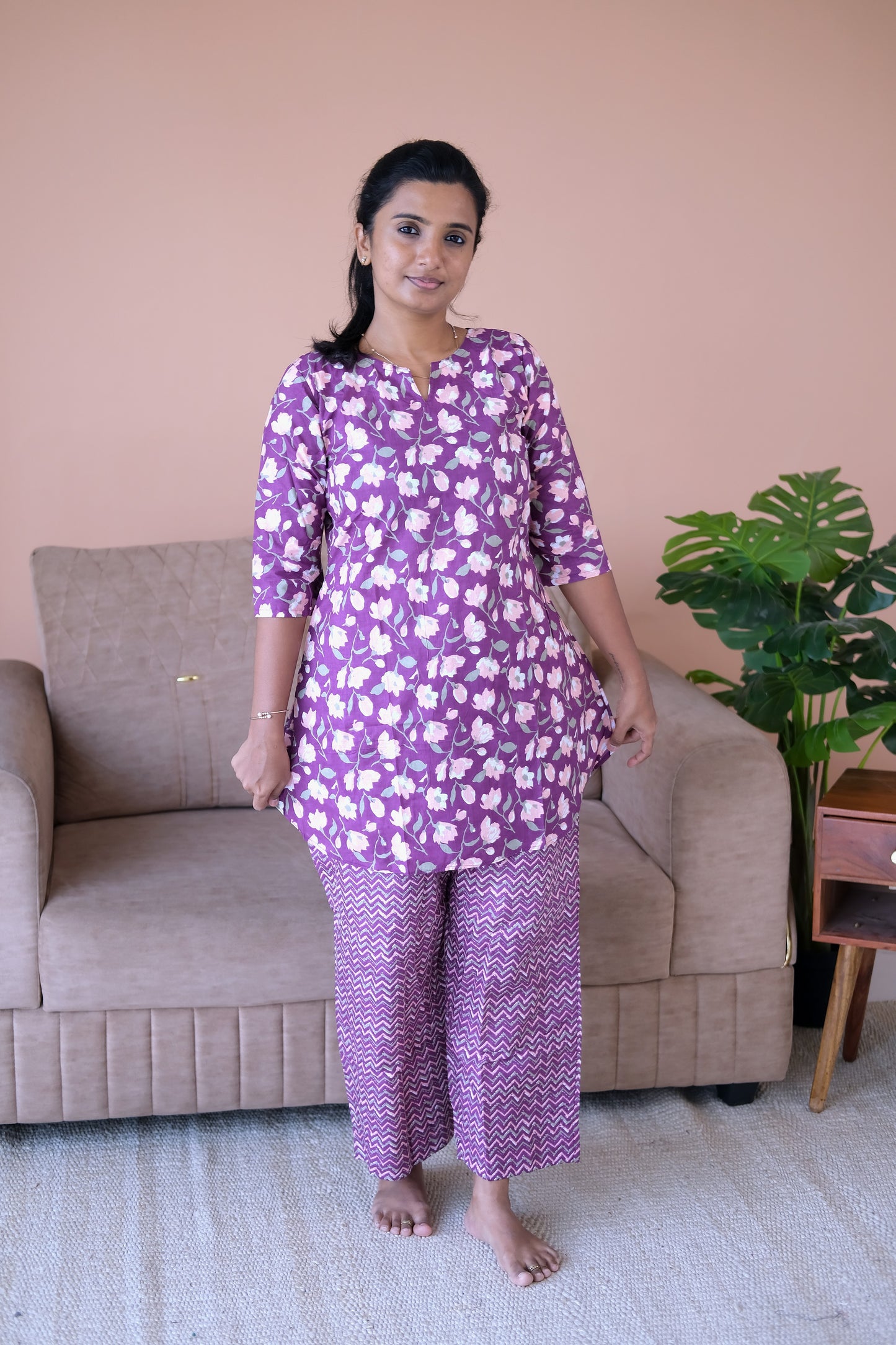 Comfortable purple cotton night suit with a floral tunic and geometric print pants.