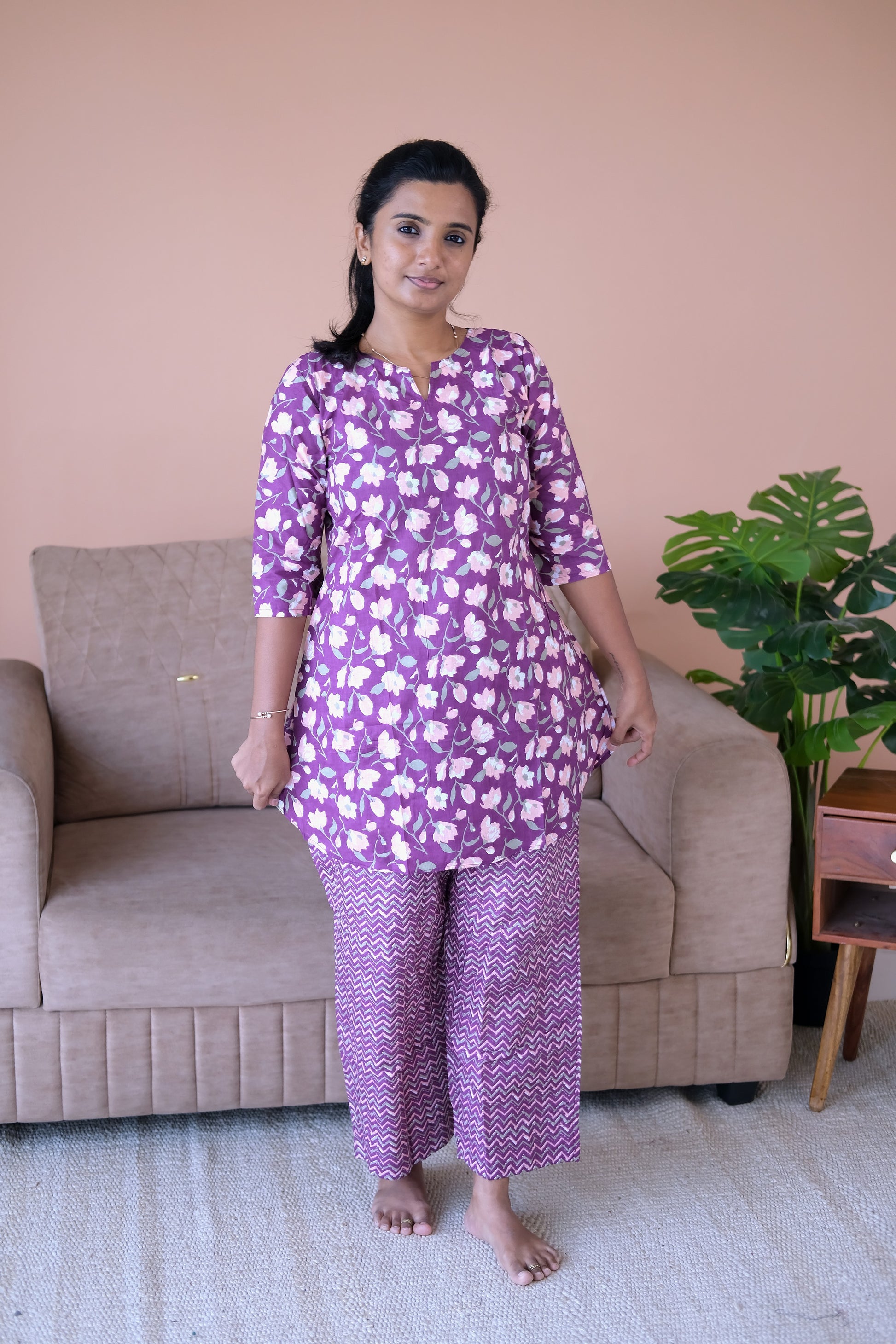 Comfortable purple cotton night suit with a floral tunic and geometric print pants.