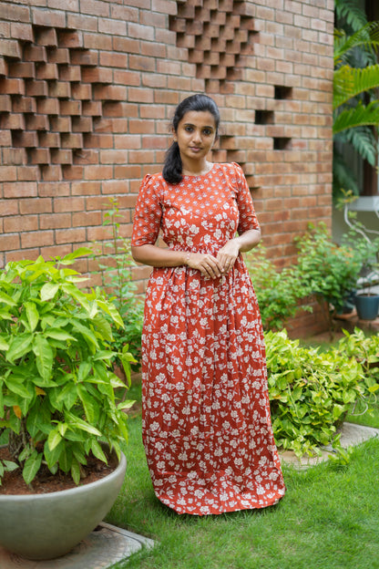 Comfortable ladies cotton maxi nighty in rust red with a relaxed fit and gathered waist