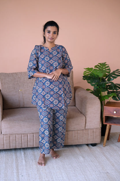 Front view of a printed loungewear set in indigo cotton with relaxed-fit pants