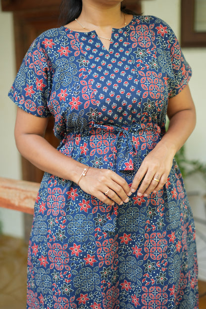 Close up of notched neck and tie-up detail on navy blue feeding nighty