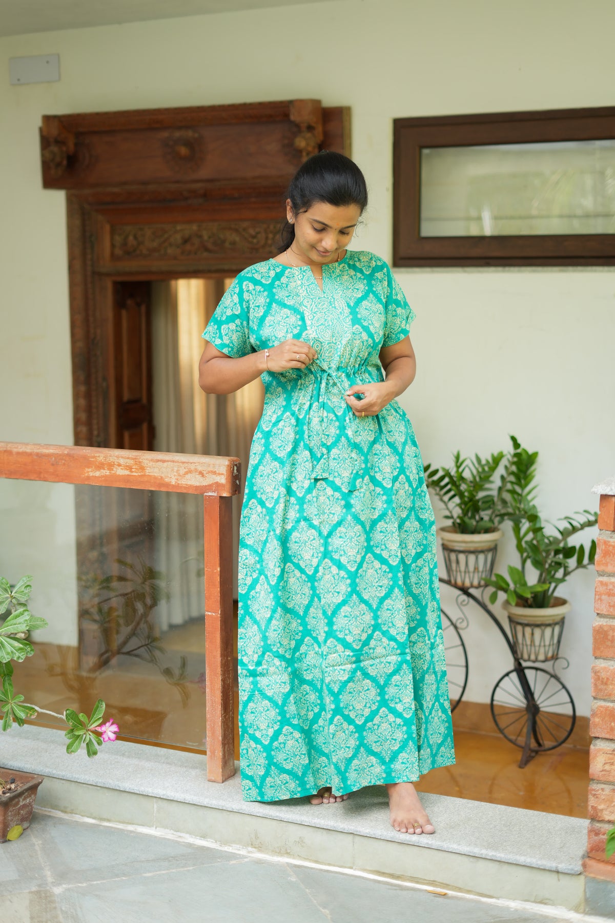 Close up of the adjustable drawstring tie on the teal green cotton maxi nighty